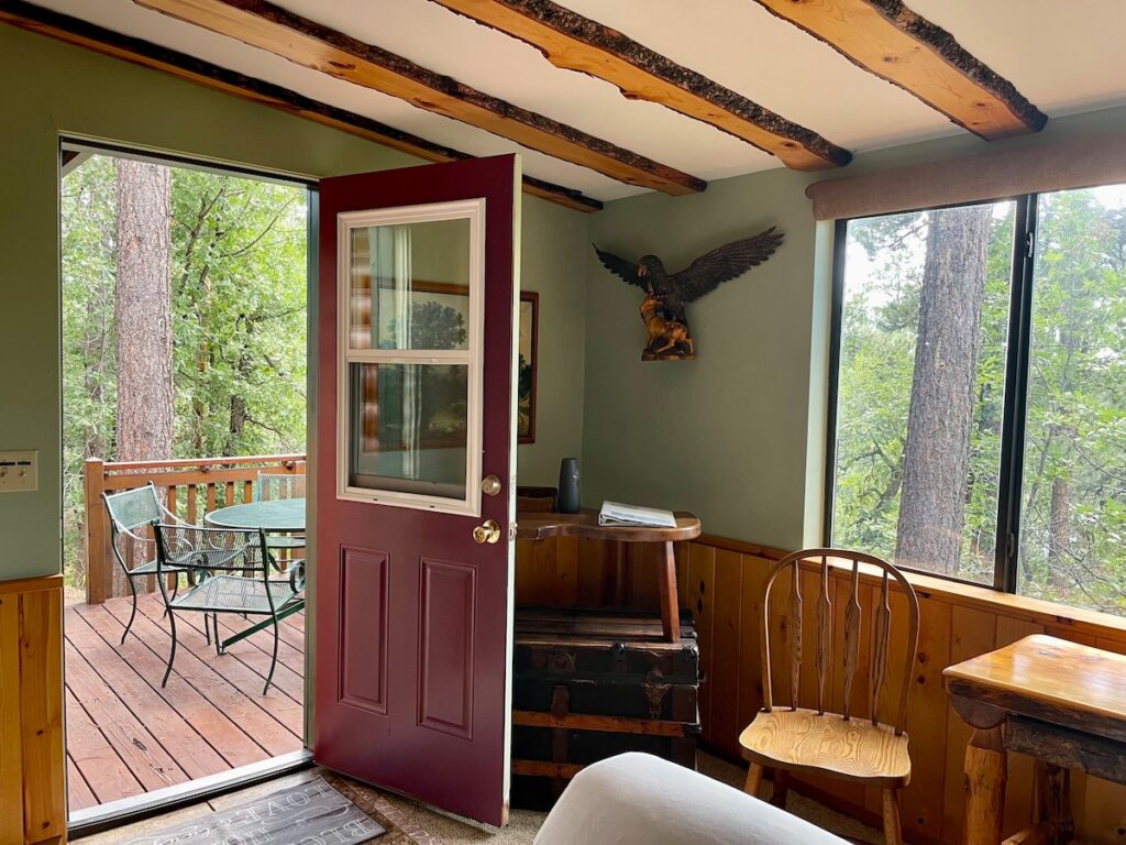 Cabin 3: Living room corner, to the left of the picture window, with a private ourdoor seating area